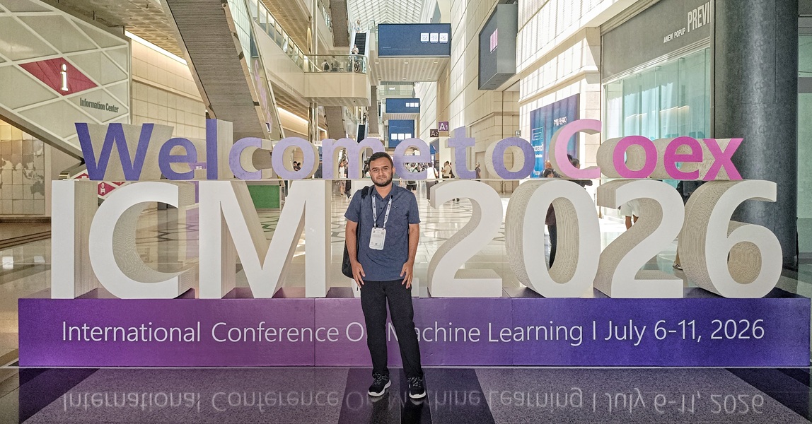 Standing at the Welcome to Coex ICML 2026 sign in Seoul